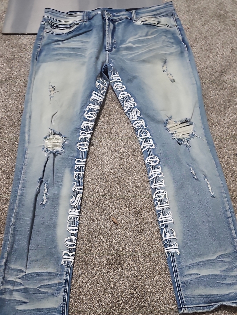Light Blue Distressed Skinny Jeans with White Side Script